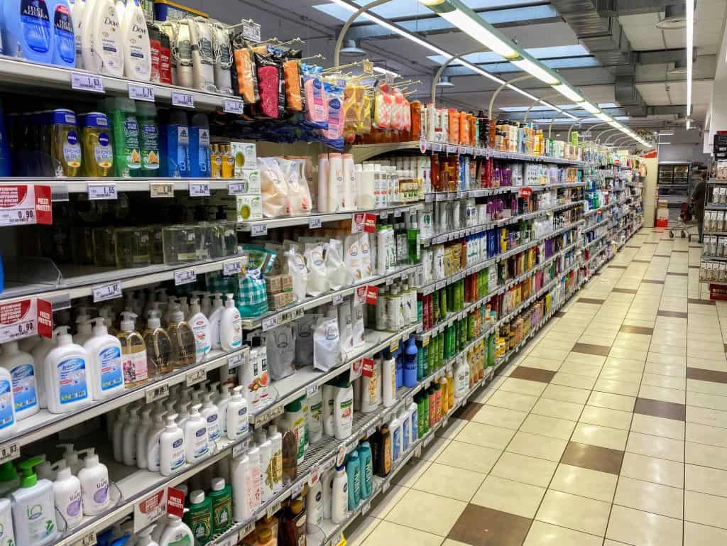 Toiletry aisle in an Italian grocery store.  You can see brands that may be familiar, like Dove, Loreal, and Pantene.