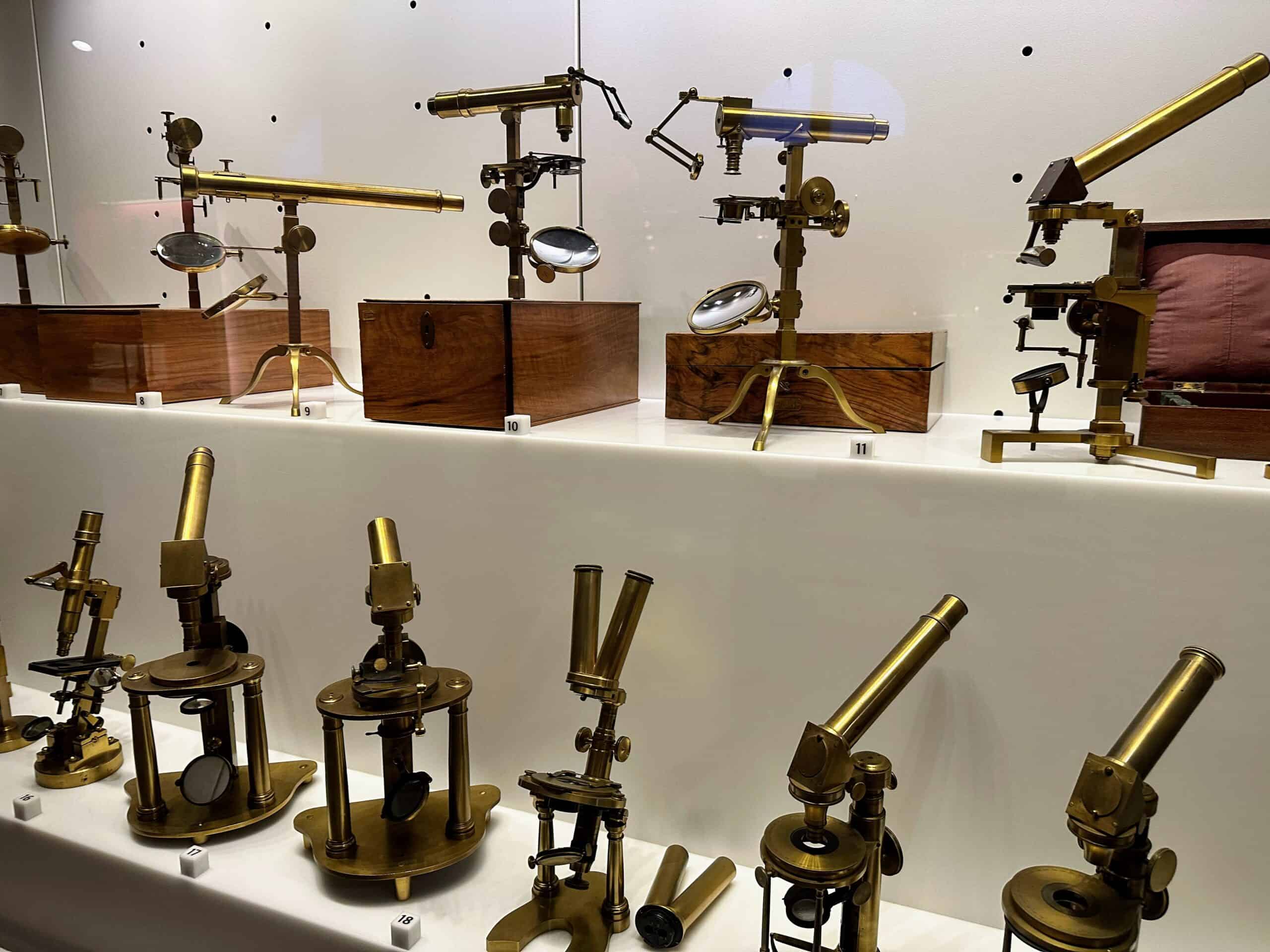Microscopes on display behind glass at the Galileo Musuem in Florence, Italy.