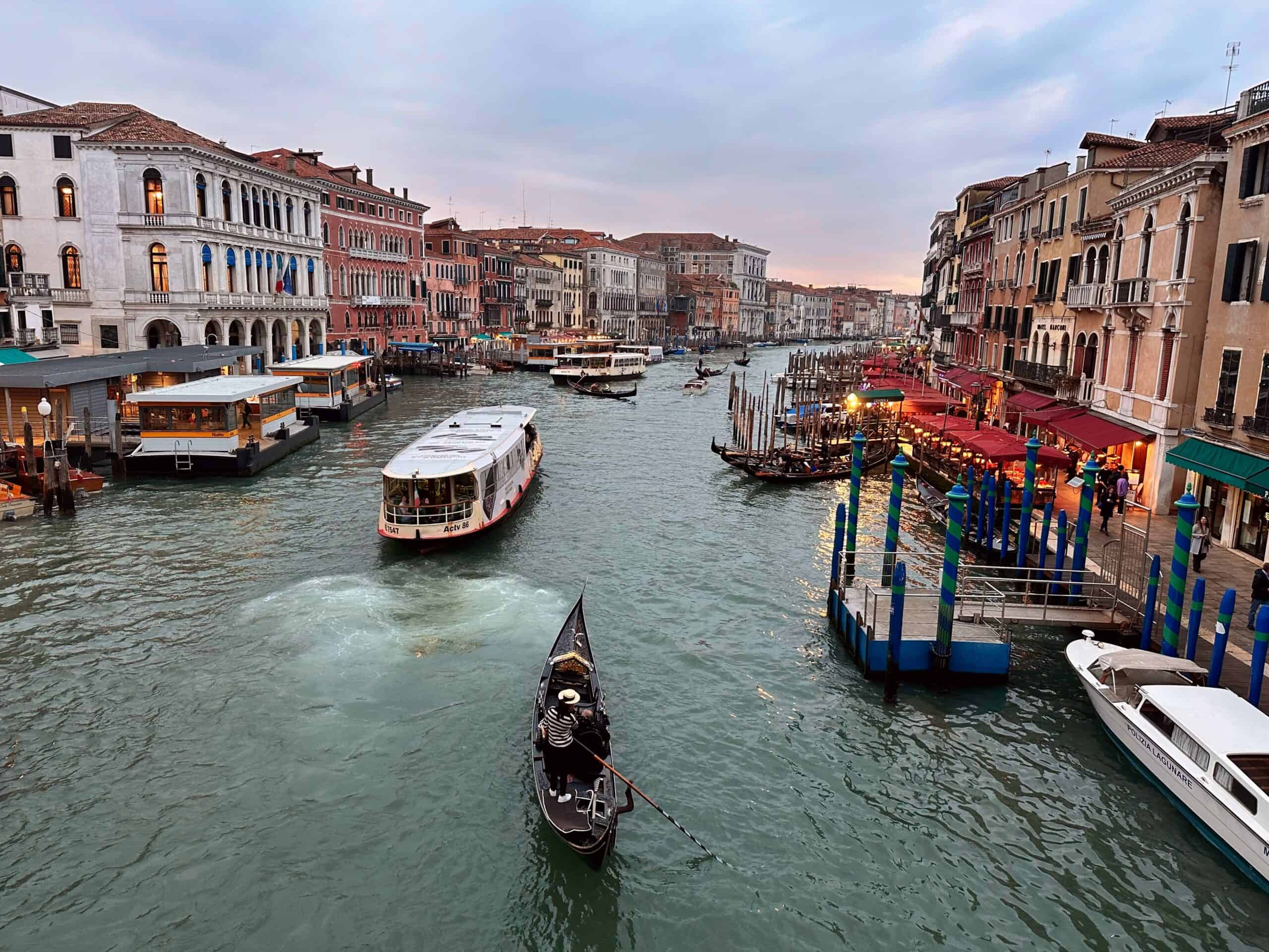 Sunset view of the Grand Canal from the Rialto Bridge in Venice, Italy.