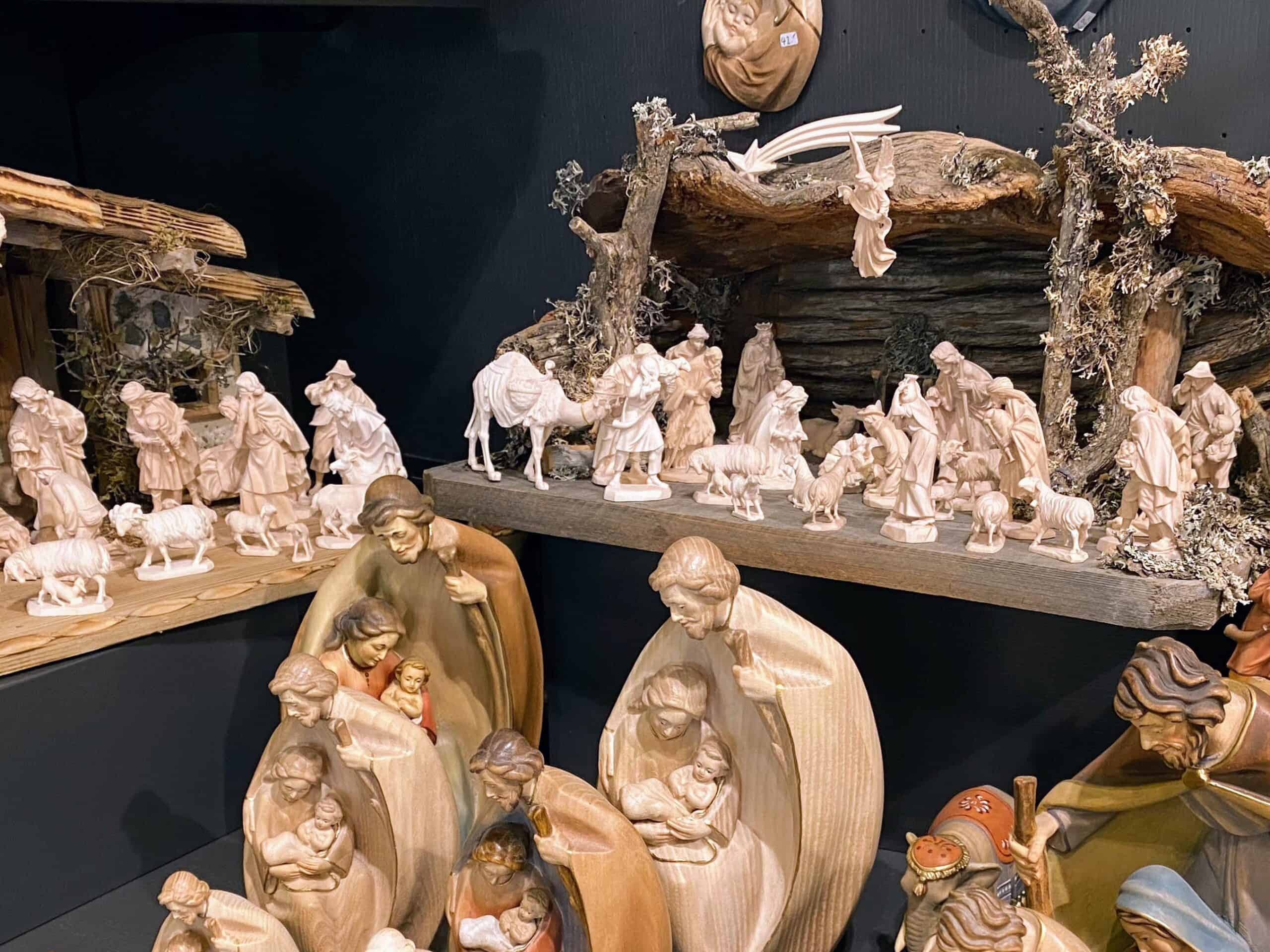 Presepe pieces for sale on shelves in a shop in Ortisei in the Dolomites, Italy.