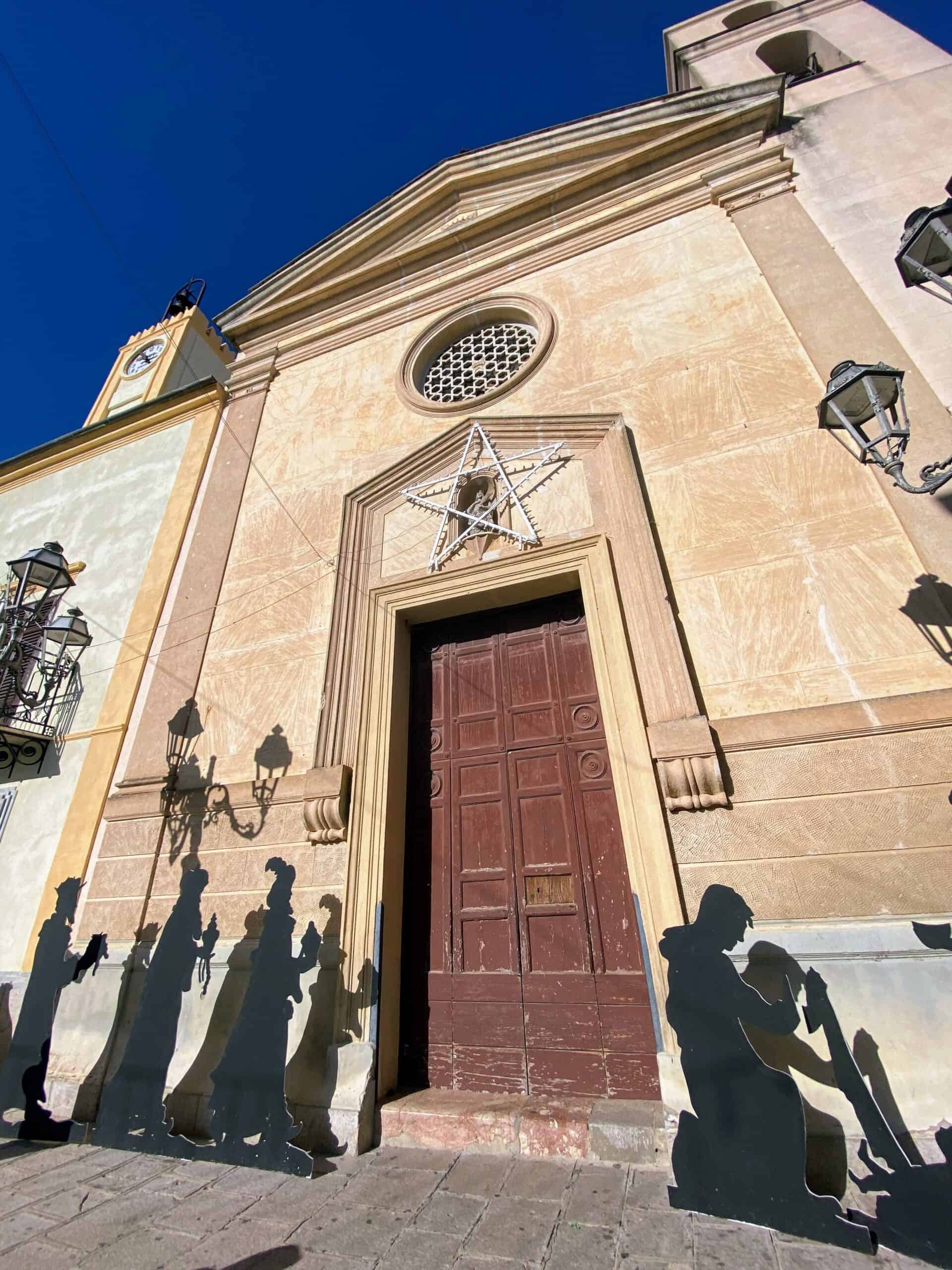 A simple presepe on display in front of a church in Santa Cristina Gela, Sicily.